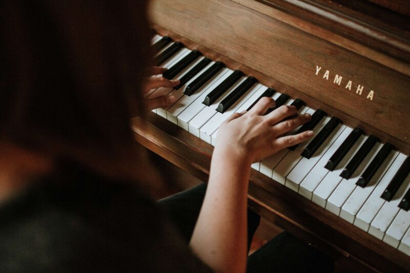 child playing an easy classical piano song on piano