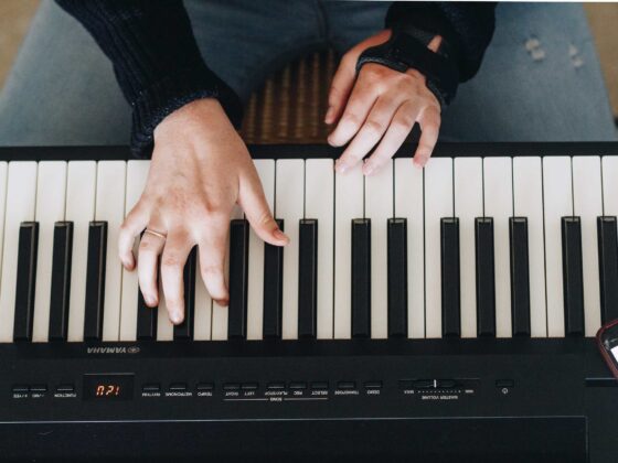 a piano player playing piano with both hands