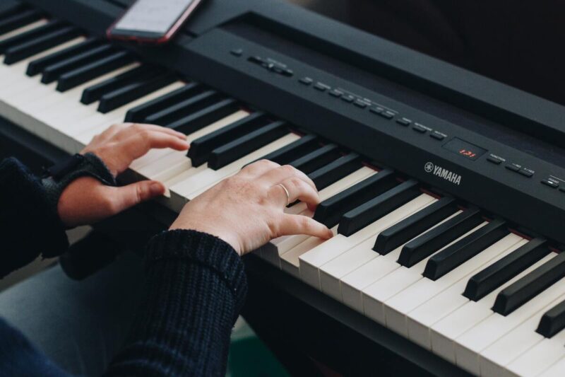 a beginner playing an easy piano song in c major