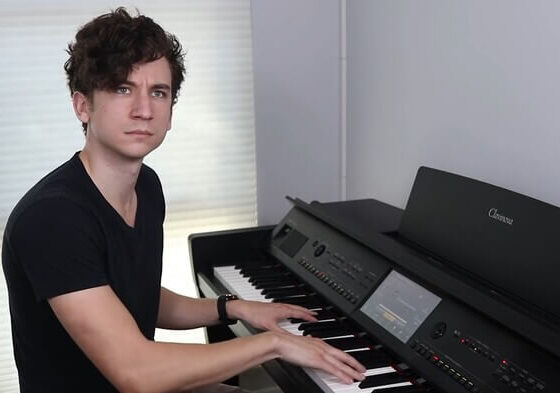 youtuber daniel thrasher is playing the piano
