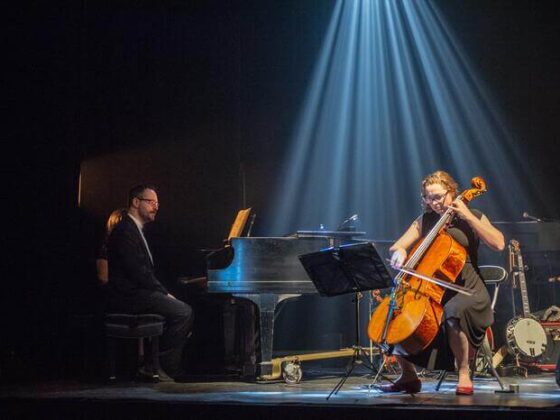 a duo is playing piano and cello duet pieces